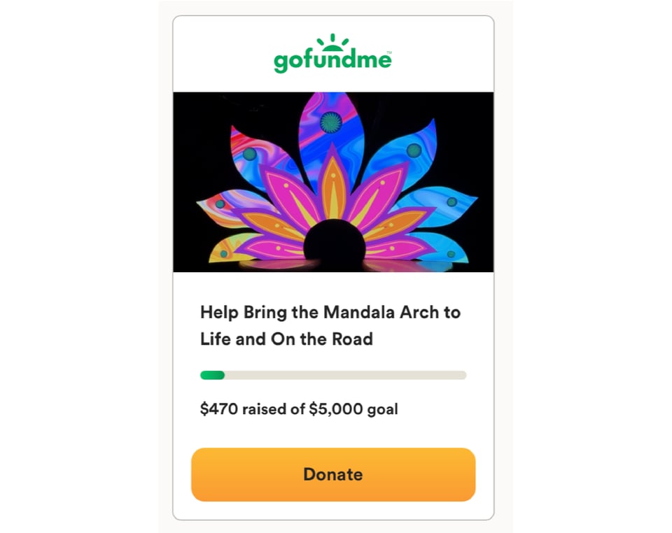 Screenshot of GoFundMe fundraiser details. GoFundMe logo at the top, followed by image of colorful lotus. Text says Help Bring the Mandala Arch to Life and On the Road. Below progress bar it says $470 raised of $500 goal. Orange donate button at the bottom.