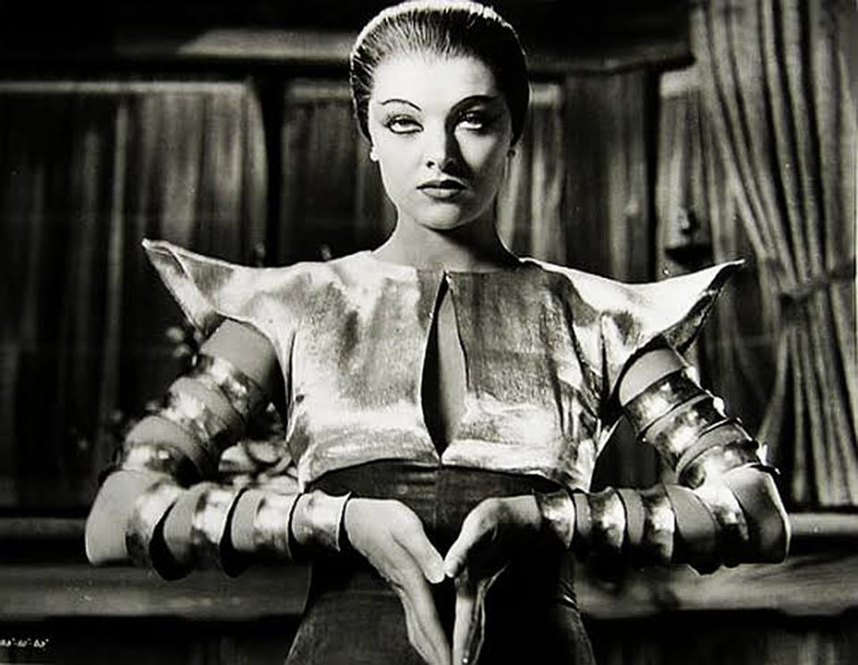 Myrna Loy, stunning as Ursula Giorgi in Thirteen Women