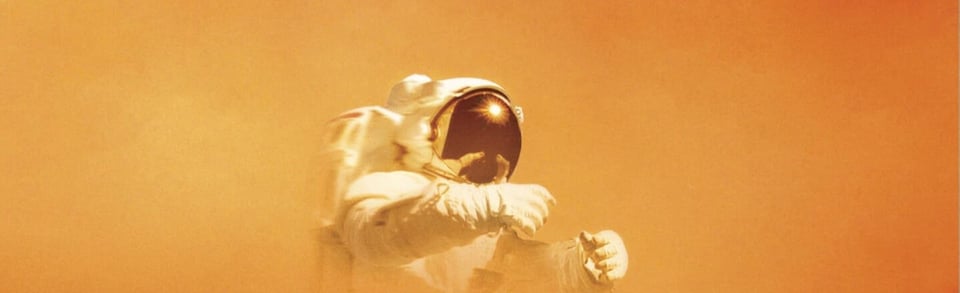 A cropped section of the cover of The Martian, showing an astronaut on an orange background