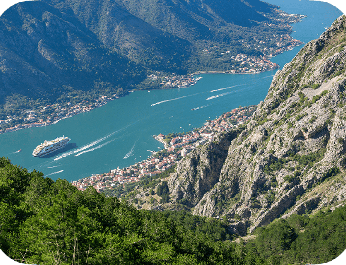 A Silversea ship sailing into the Bay of Kotor, seen from the mountains above
