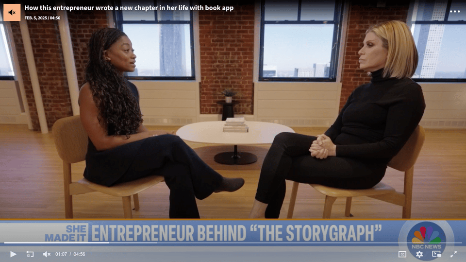 Landscape photo of me and the host, Jill Martin, sitting on chairs facing one another, with legs crossed, mid interview.