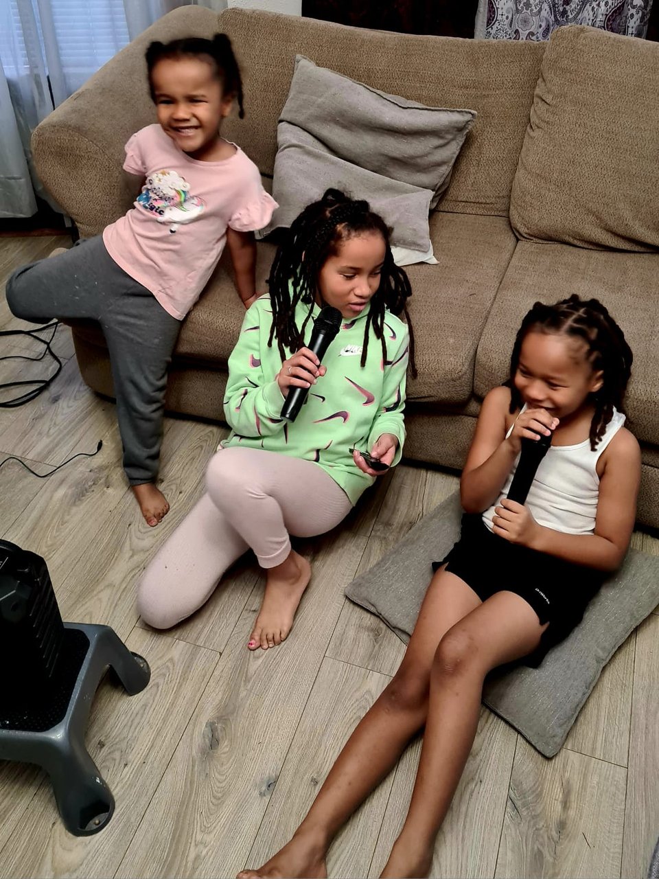 Two my nieces and my nephew singing karaoke