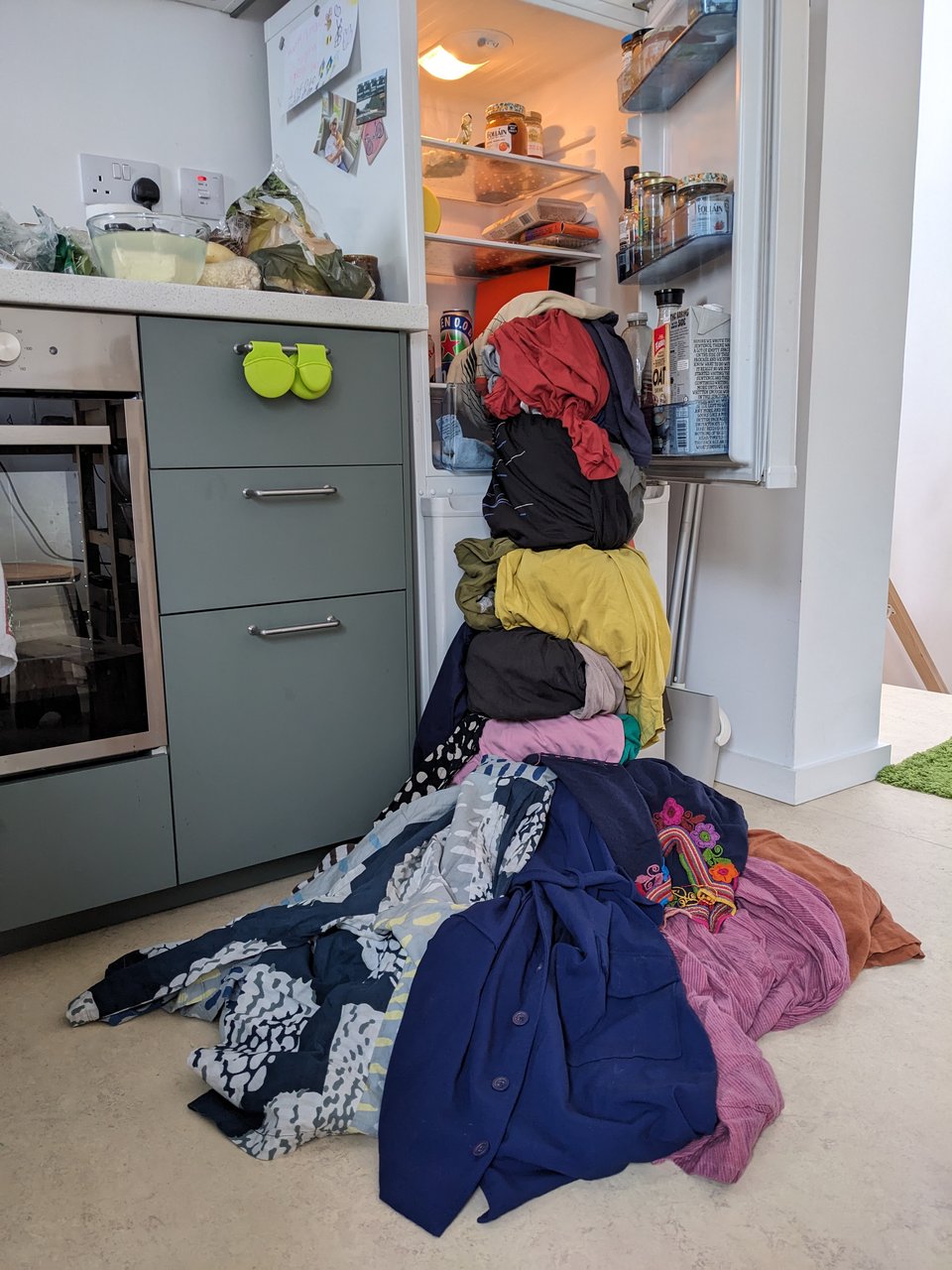 Clothes blob, flowing out of the fridge