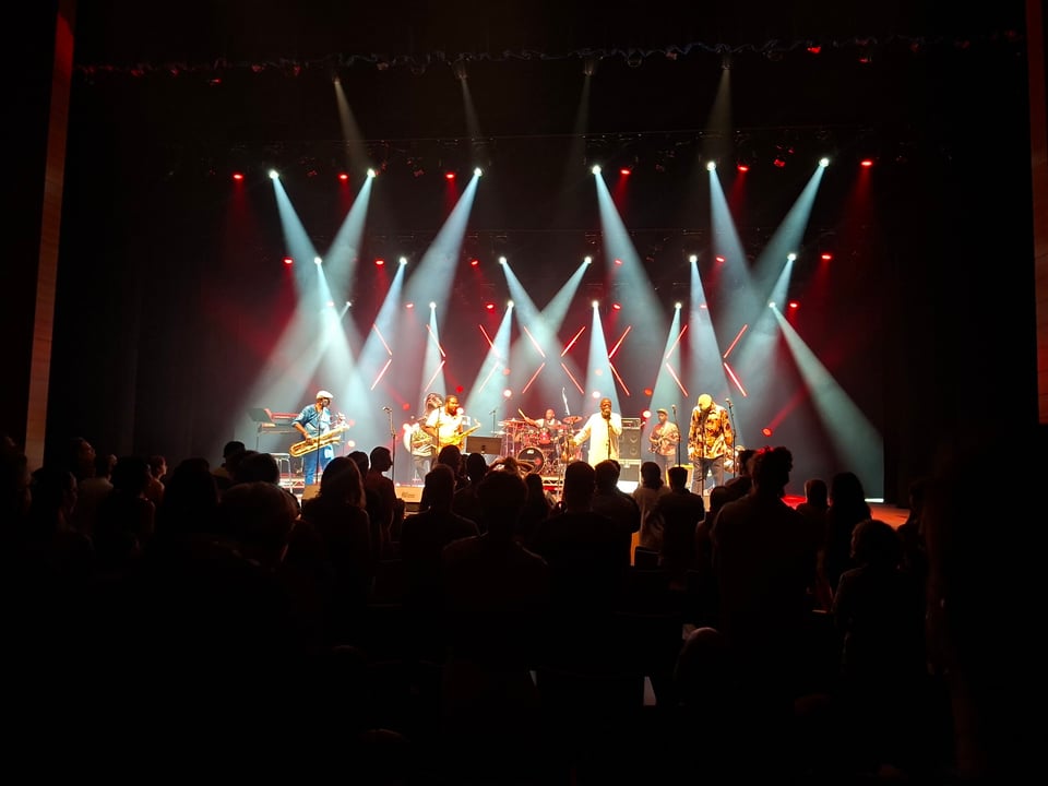Photo the six member brass band on stage