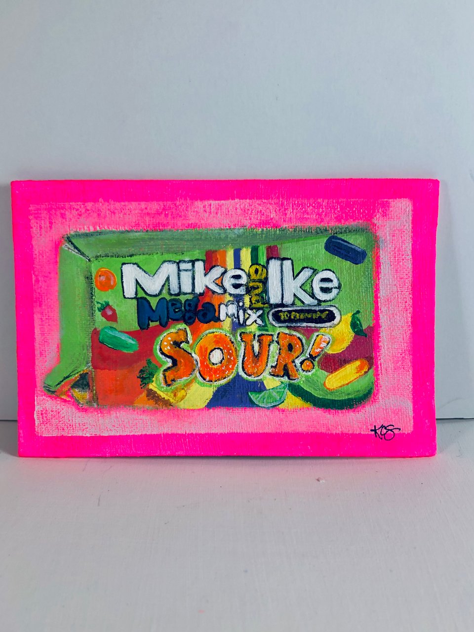 a painting of a box of mike and ike mega mix
