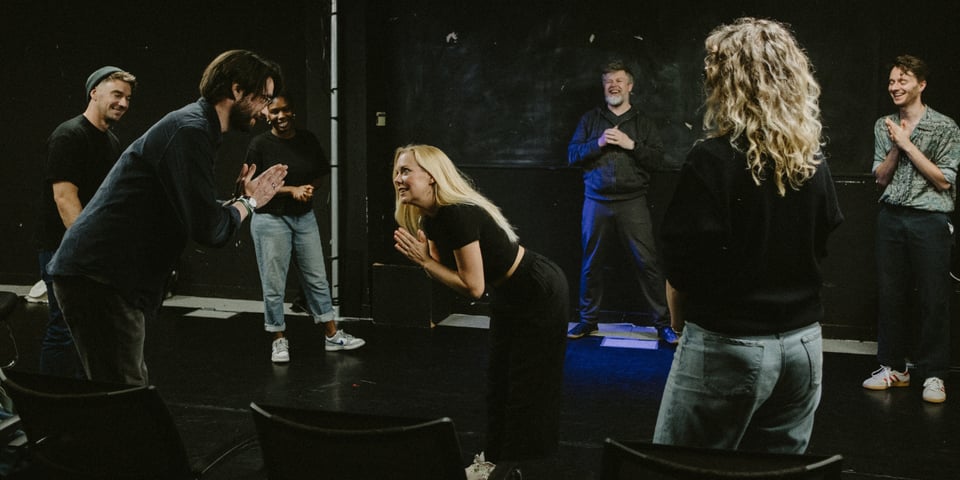 The Pretend Company warm up.