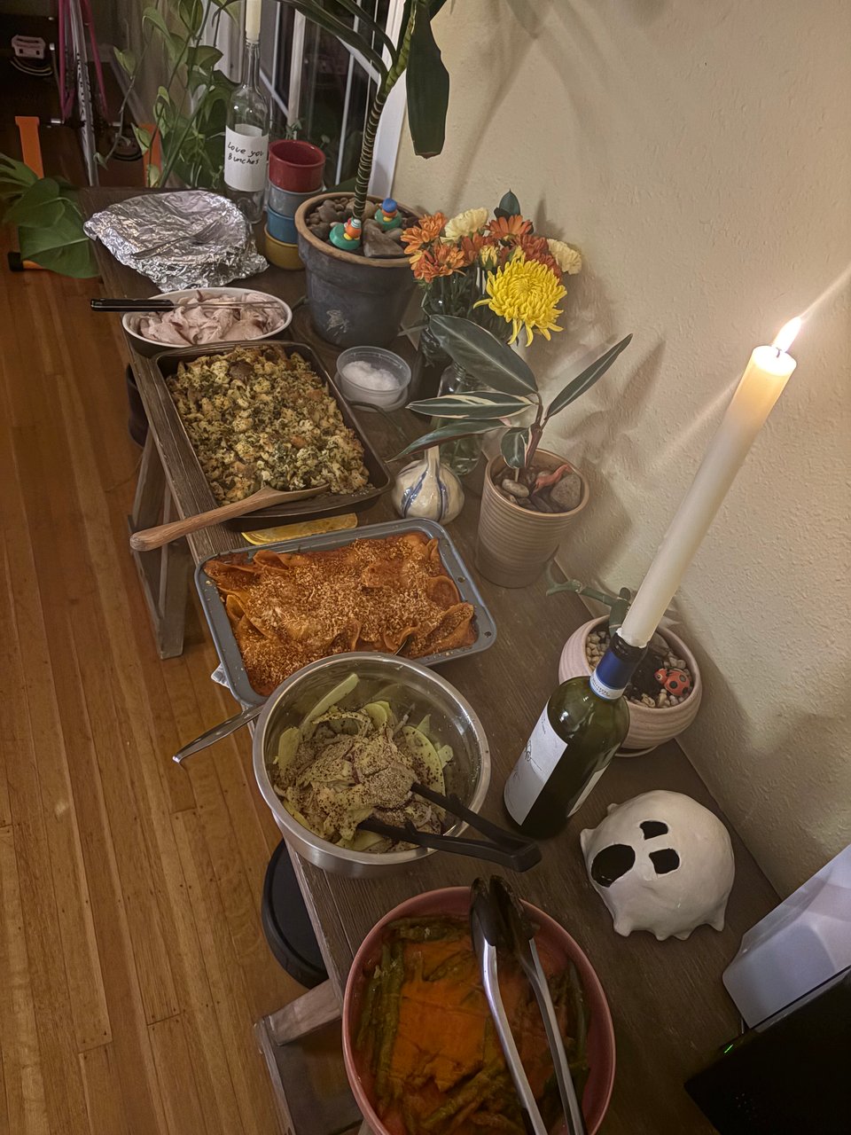 Much of the final spread: carrots covered by foil, stuffing, makhani mac 'n' cheese, mango ceviche, and loubieh.