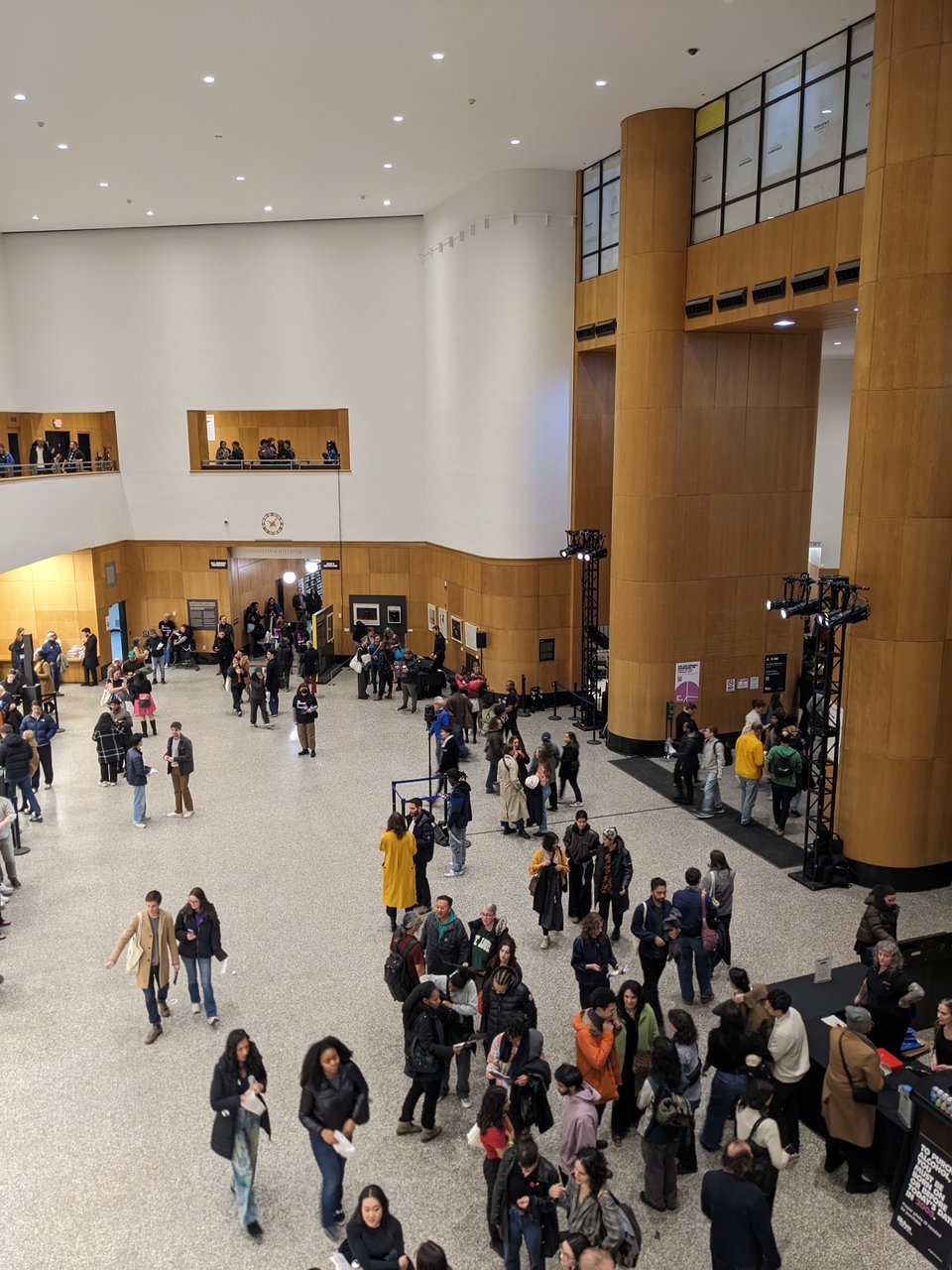 dozens of people milling in the Grand Lobby as viewed from the second floor balcony, probably around 10:30pm