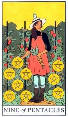 The Modern Witch 9 of Pentacles card. A woman stands in a field of tomatoes with a bird on her arm. There are nine gold coins.