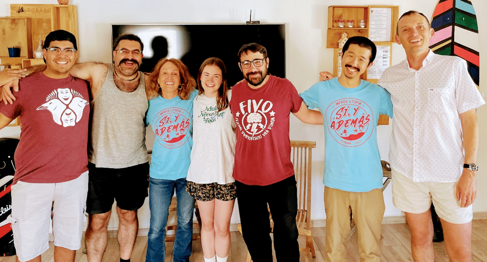 seven improvisers posing for a picture
