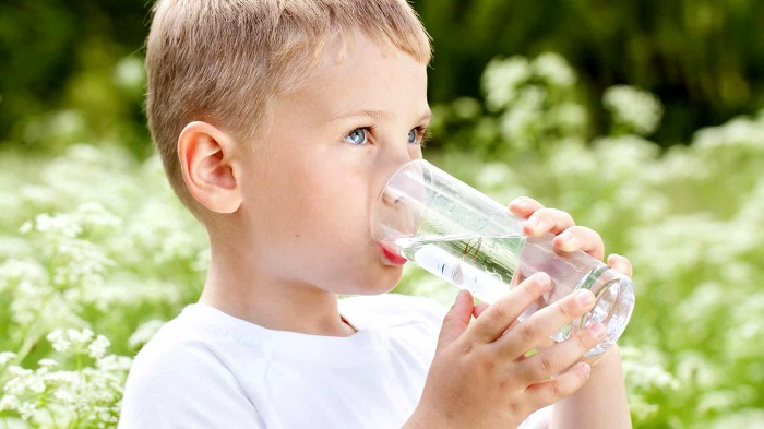 Child drinking from a glass