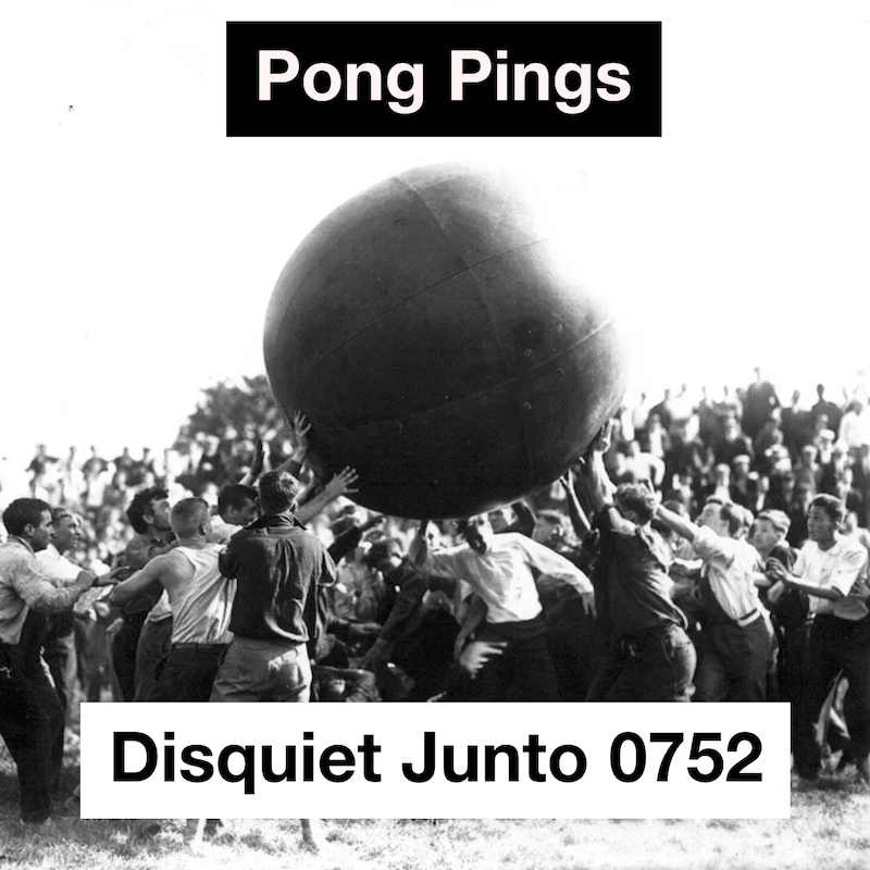 A crowd of people holding a large ball aloft, plus the name and number of the project