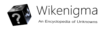 A screenshot of the “wikienigma” name in a large font, with the catchphrase beneath it: “an encyclopedia of unknowns.” On the left is the logo, a large black cube showing three faces, with a question mark on each face