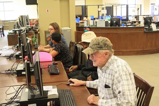 Community members using library computers at the main library.
