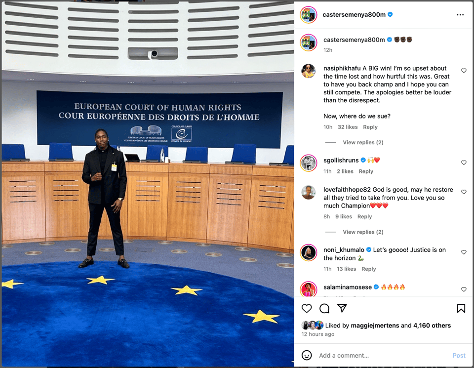 A photograph of Caster Semeya, wearing a black suit standing in front of a series of empty chairs and a sign that says "European Court of Human Rights Cour Européen Des Droits De L'Homme"