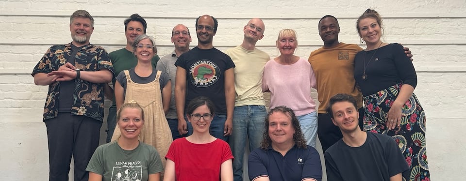 A smiling group of improvisers.