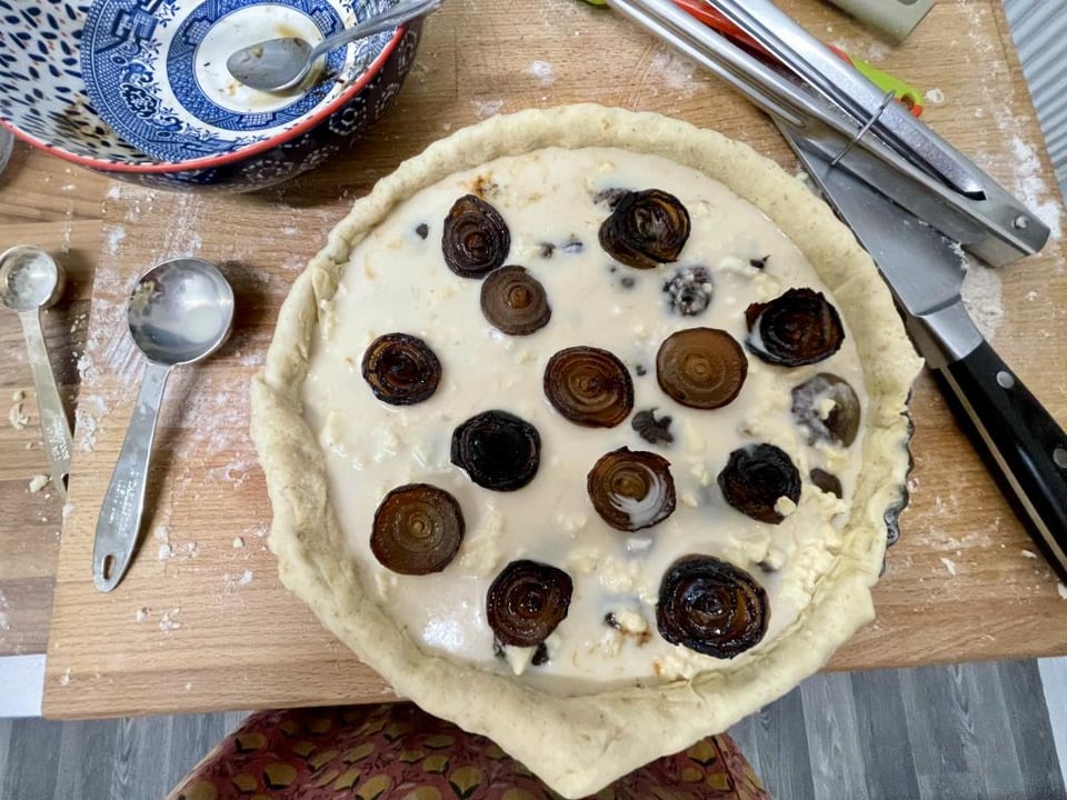 An uncooked onion tart