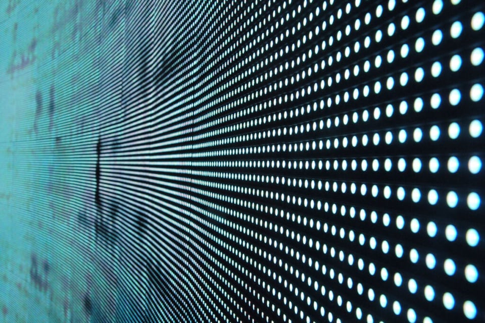 A zoomed in LED scree with Big Brother from "1984" vibes