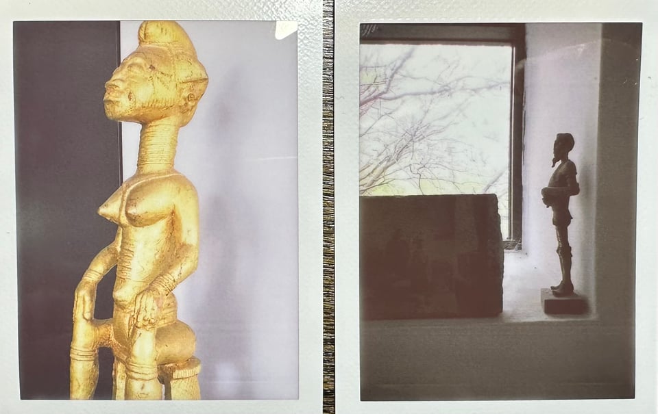 Two instax photos: left is a gold sculpture/statue of a seated woman; right is a windowsill with a figurine of a man and a photo