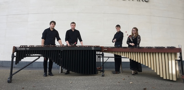 Four musicians with their percussion instruments.