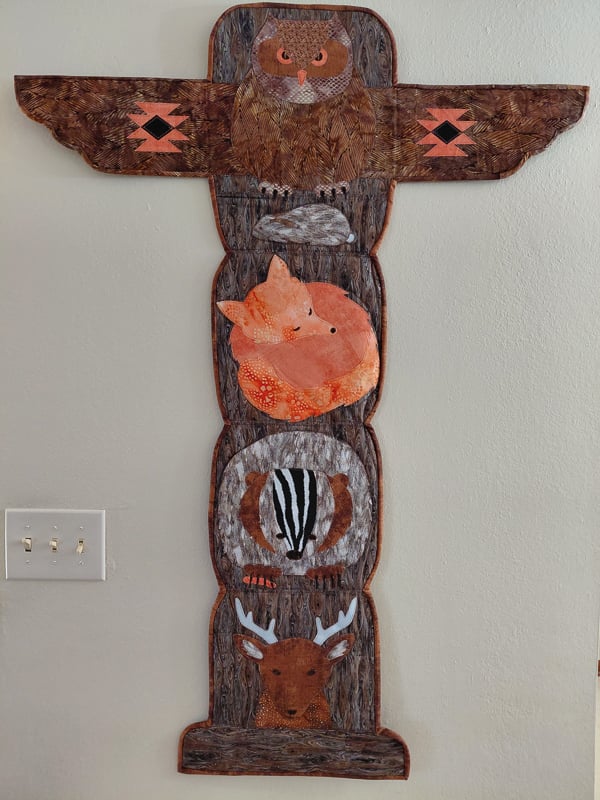 “Prairie Totem Pole,” 2026, pieced, quilted and designed by Debra Ninas of Elgin, Minn. Says Ninas:  “This totem pole represents some of the animals that make the prairie their home.”