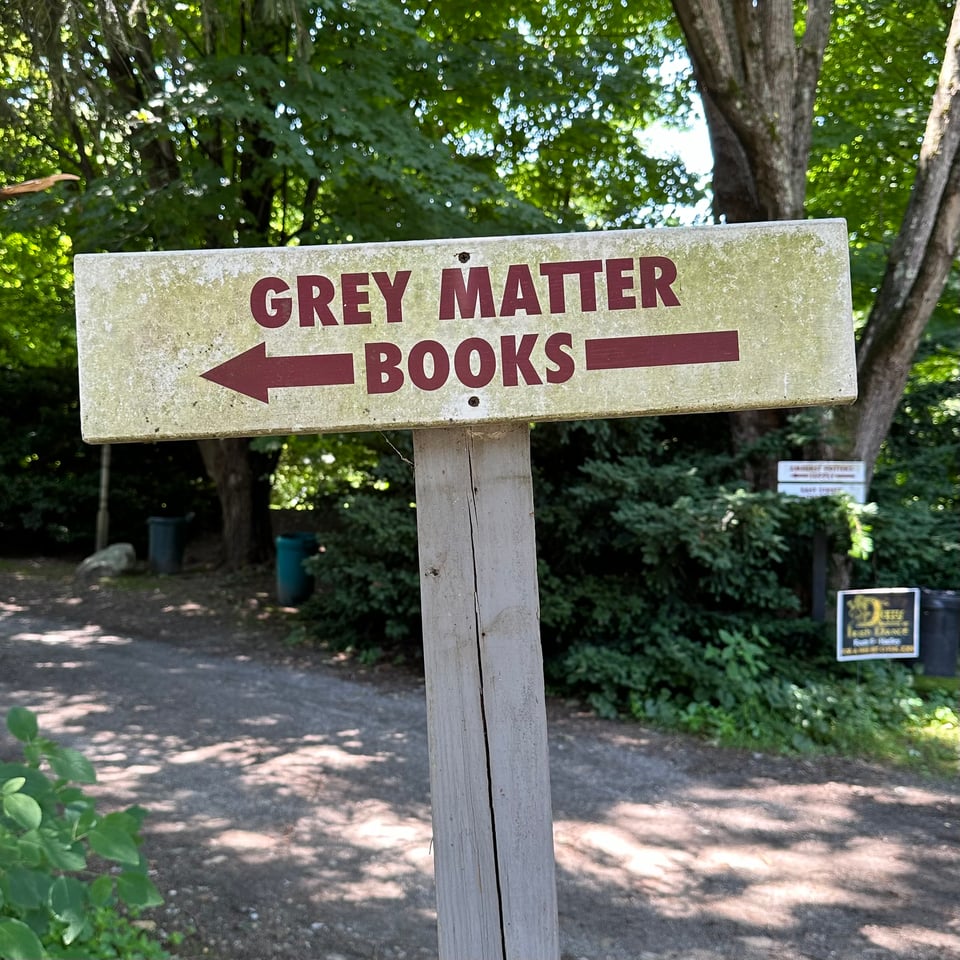 Photo of a sign for Grey Matter Books, a used bookstore in Hadley, MA