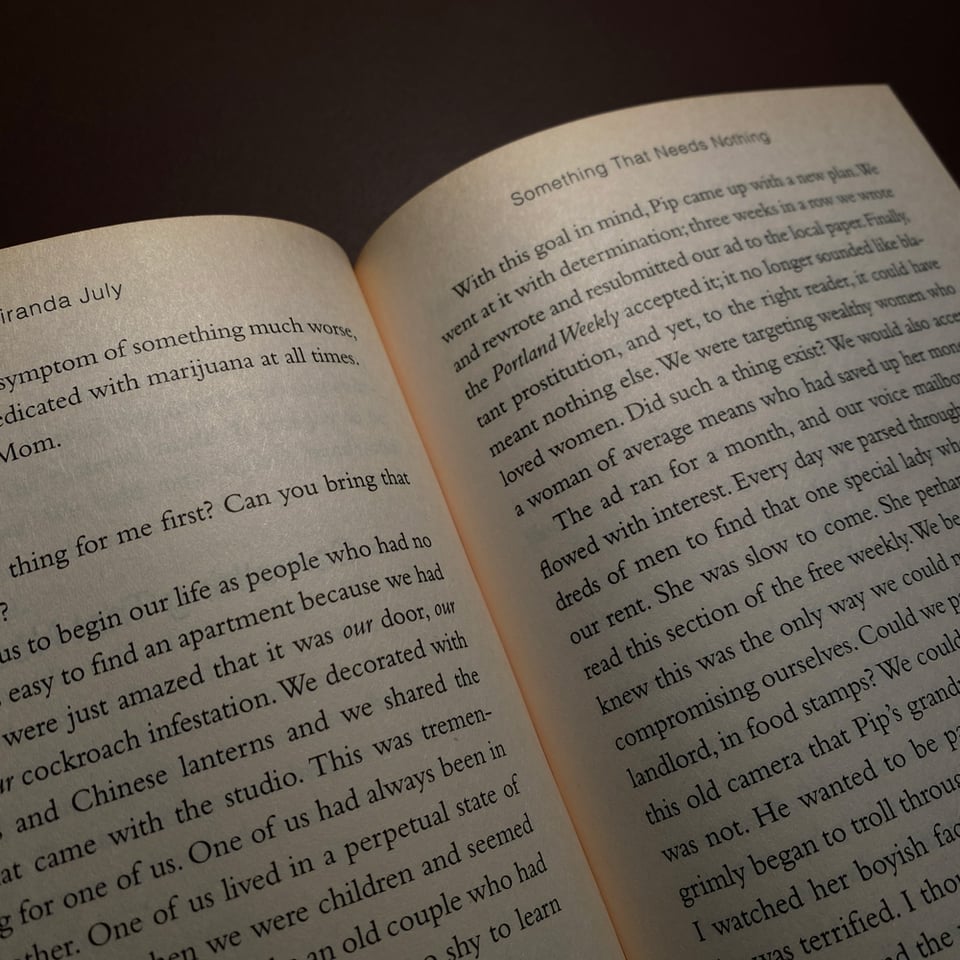 Open book in the dark, where the middle part shines in fluorescent red