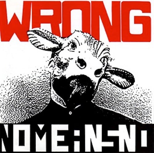 What looks like a photo, that has been photocopied as to render black and white and reduce details, of a man wearing a cow or goat mask. He wears a black shirt that is buttoned all the way up.