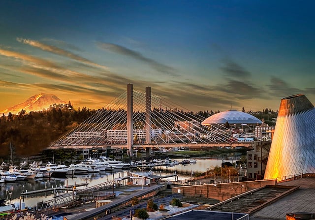 A high-resolution artistic photo of the Tacoma cityscape with a sunlit  Mount Rainier in the background