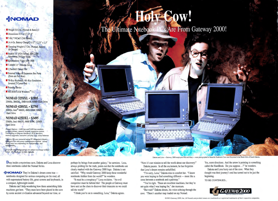 A two-page magazine advertisement for the Nomad laptop. The photograph shows a man and woman standing in a cave marveling at what is supposed to be laptops naturally occurring in the wild. The headline simply says "Holy Cow!"