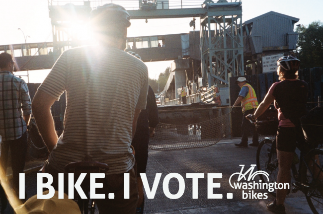 people riding bikes on a bridge with the text "I Bike, I Vote"