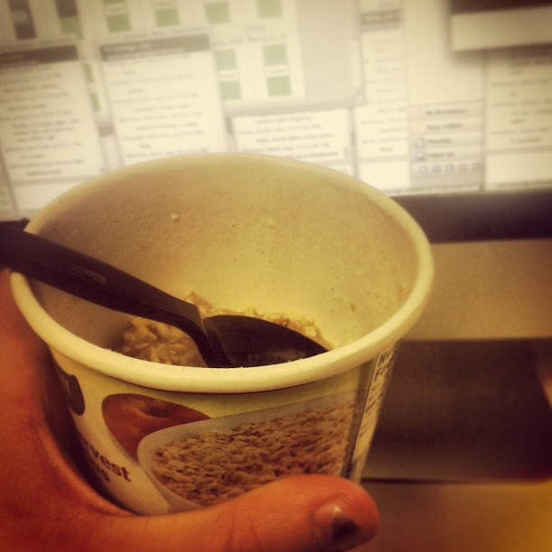 A microwave cup of oatmeal in front of my monitor