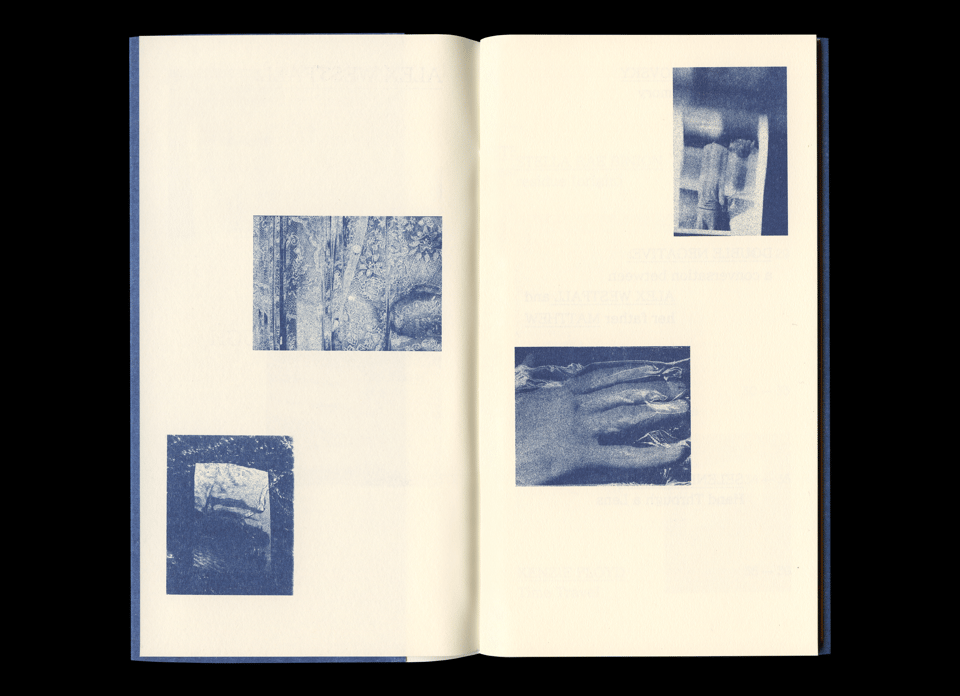 An open booklet spread on cream paper with a blue cloth spine. Four duotone photographs in blue and cream are arranged asymmetrically across both pages: upper left, a close-up of a textured organic surface, possibly bark or stone; lower left, a framed or windowed view of a sparse landscape or interior; upper right, a partial view of stacked or layered forms, possibly hands or architectural elements; lower right, a hand with elongated fingers resting against a dark surface.
