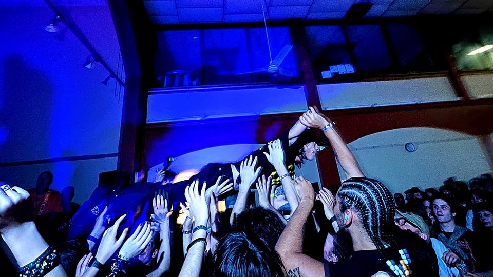 Cris Crude from pg. 99 crowd surfs