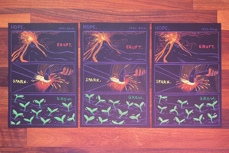 Three originals of the Hope comic, side by side.
