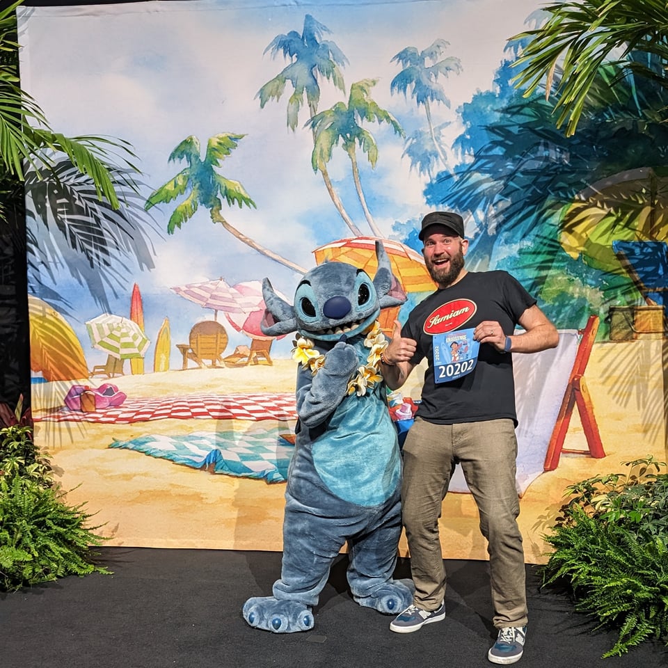 myself standing with Stitch at the runDisney expo