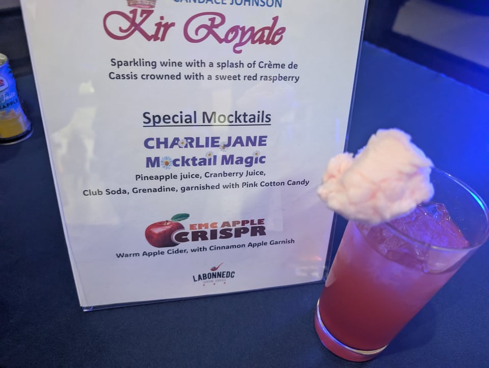 Charlie Jane Mocktail Magic: a pink drink garnished with pink cotton candy!