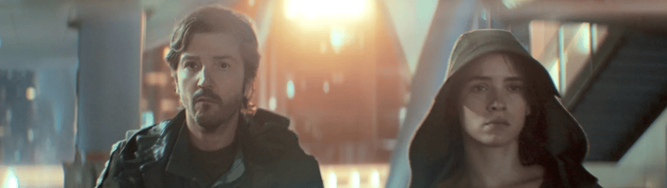 A screenshot from the show Andor. It depicts Cassian Andor and Bix Caleen walking away from an explosion.