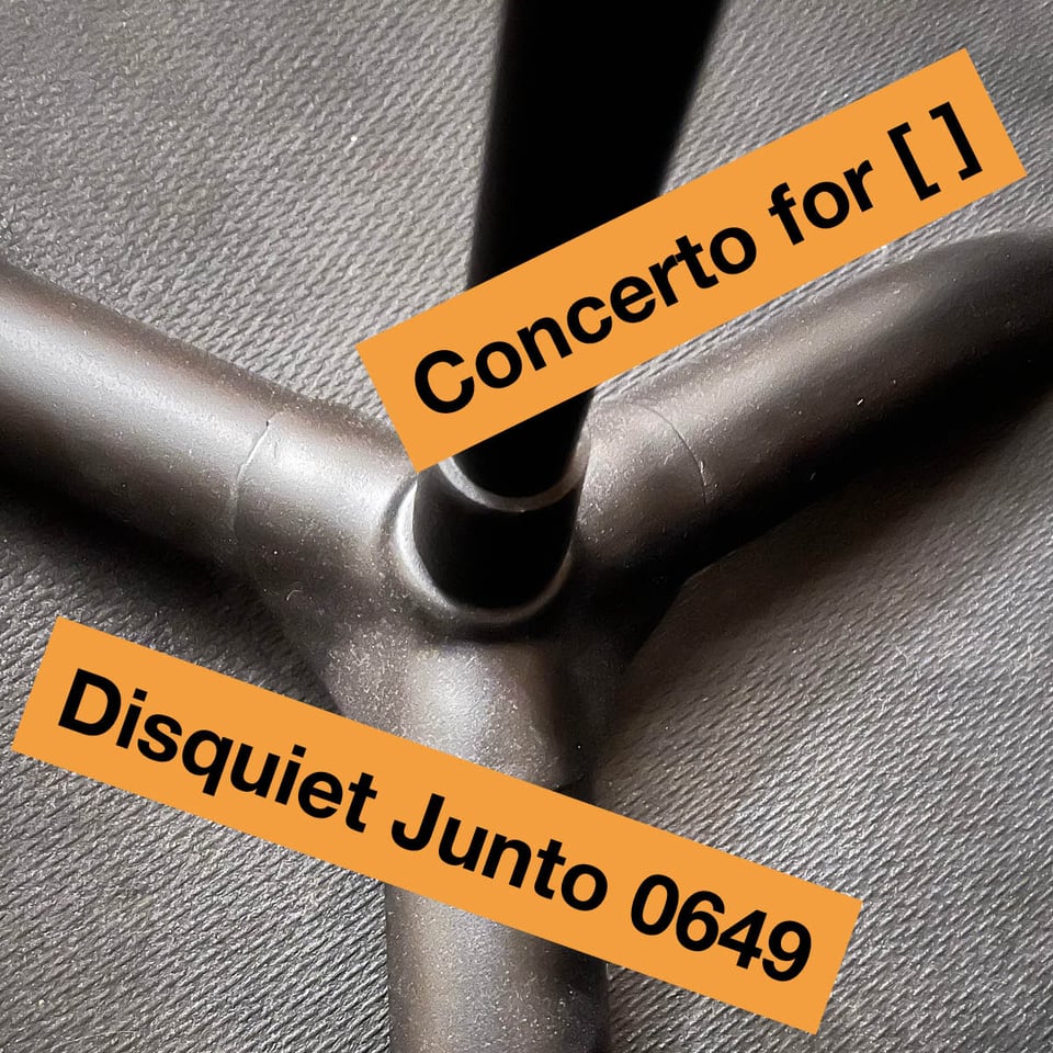 The image shows the base of a music stand with the title and number of this week's Disquiet Junto project