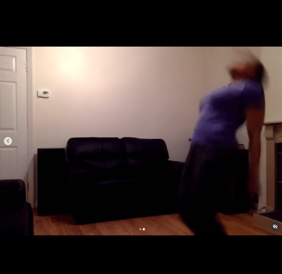 A low-resolution clip of me dancing energetically in a living room with a couch behind them.