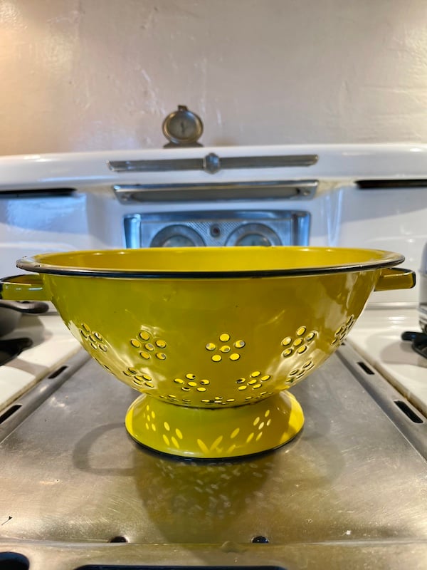 a yellow colander