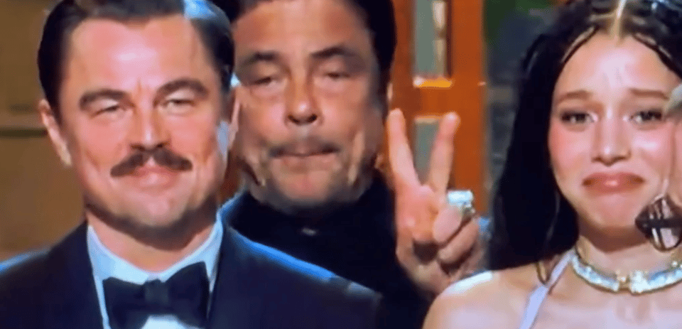 Photo of Benicio del Toro from The Oscars giving the peace sign. ✌️