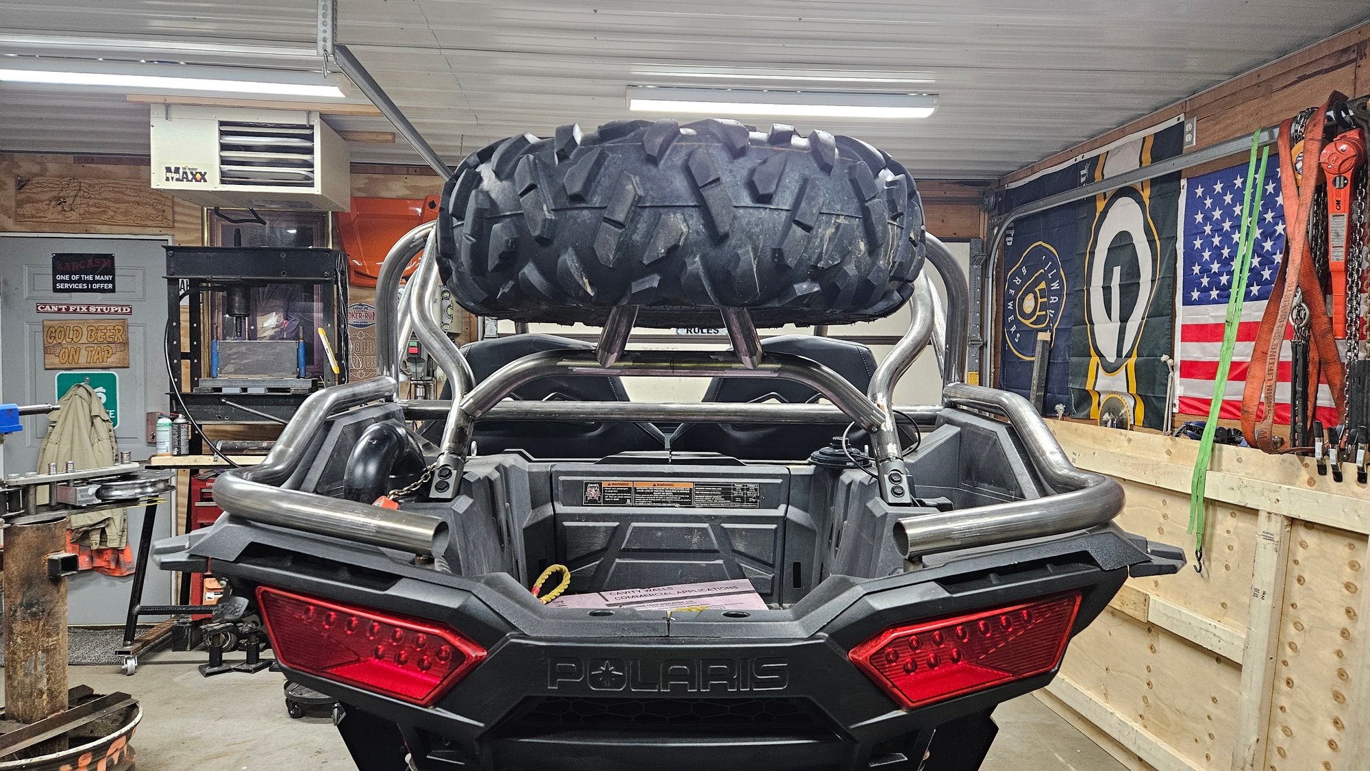 Roll cage with a spare tire, viewed from the back