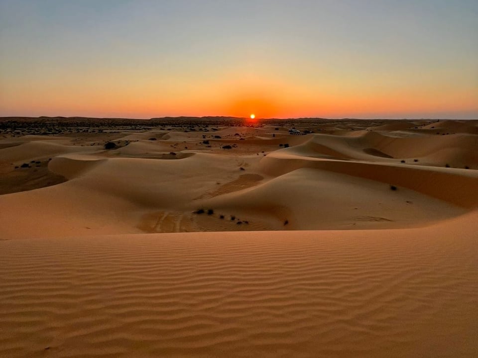 Image of the sunset over Al Quaa - Photo by Jess
