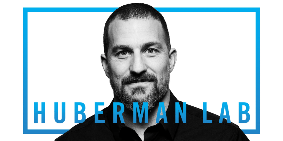 Andrew Huberman, a white middle-aged man with beard, stands behind HUBERMAN LAB in blue letters.