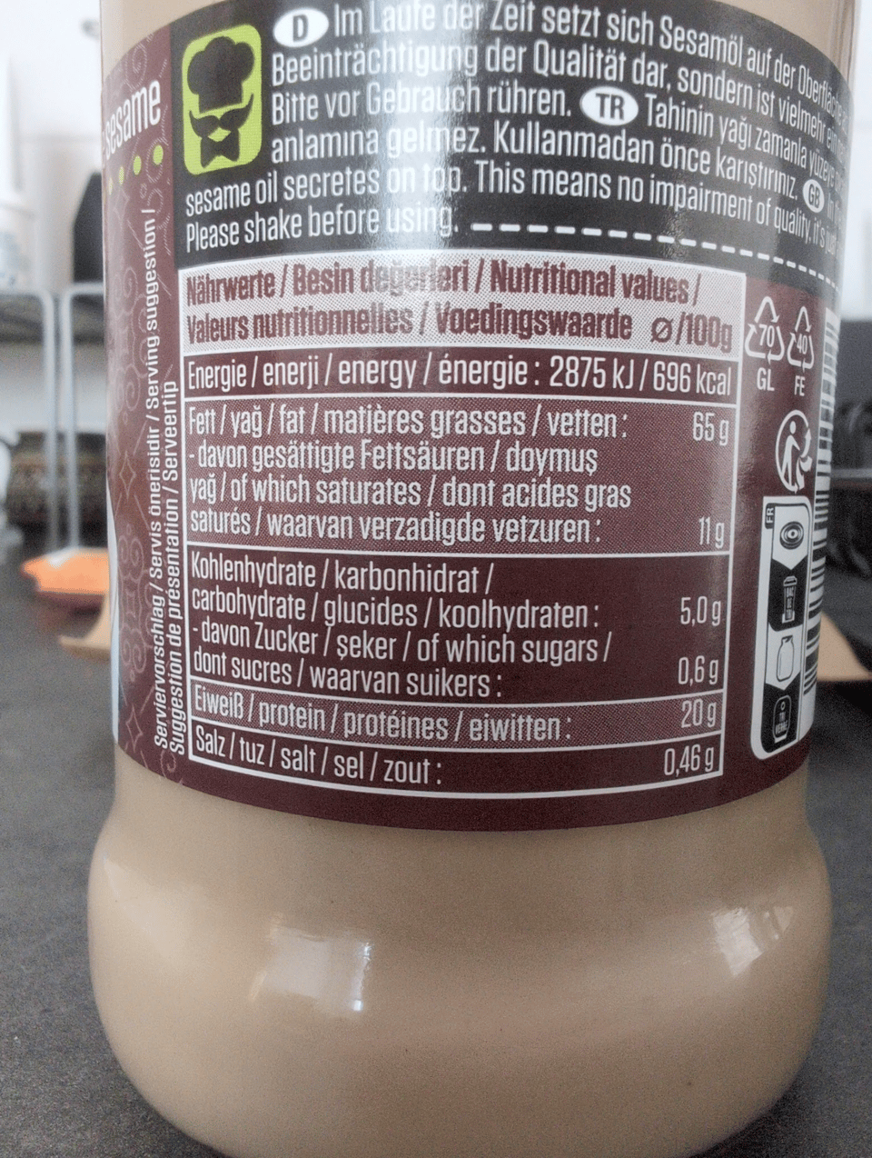 The nutritional information panel on a jar of tahini. It is printed in German, Turkish, English, French, and Dutch.