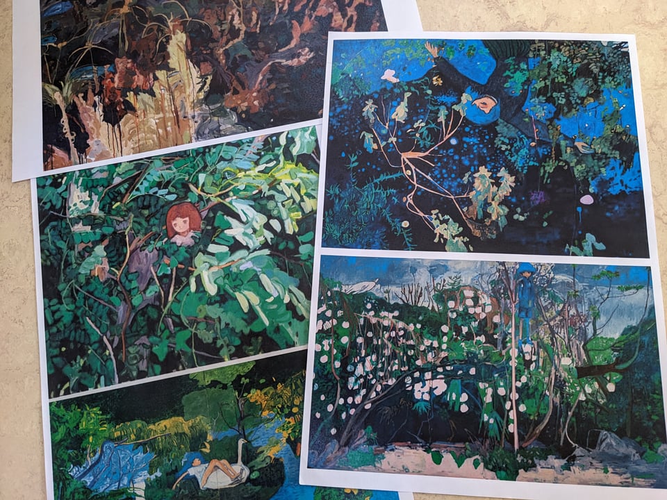 Photo of printouts of five Makiko Kudo paintings