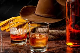 gloves, a cowboy hat, rope a bottle of whiskey and two glasses... oh my god, one of the whiskey glasses is full of whiskey AND ice... no, no, no
