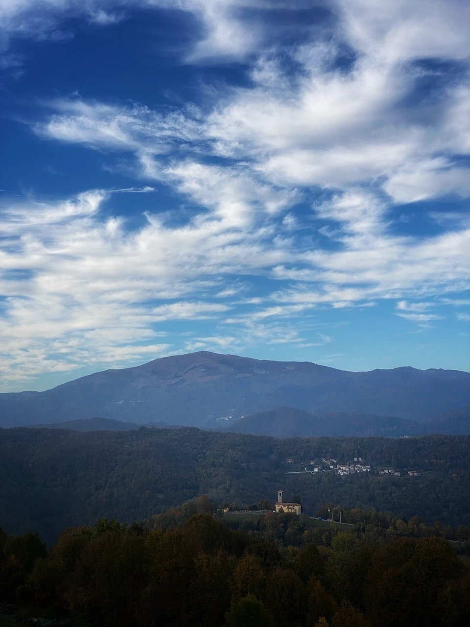 A view of Mount Matajur with a church in the foreground