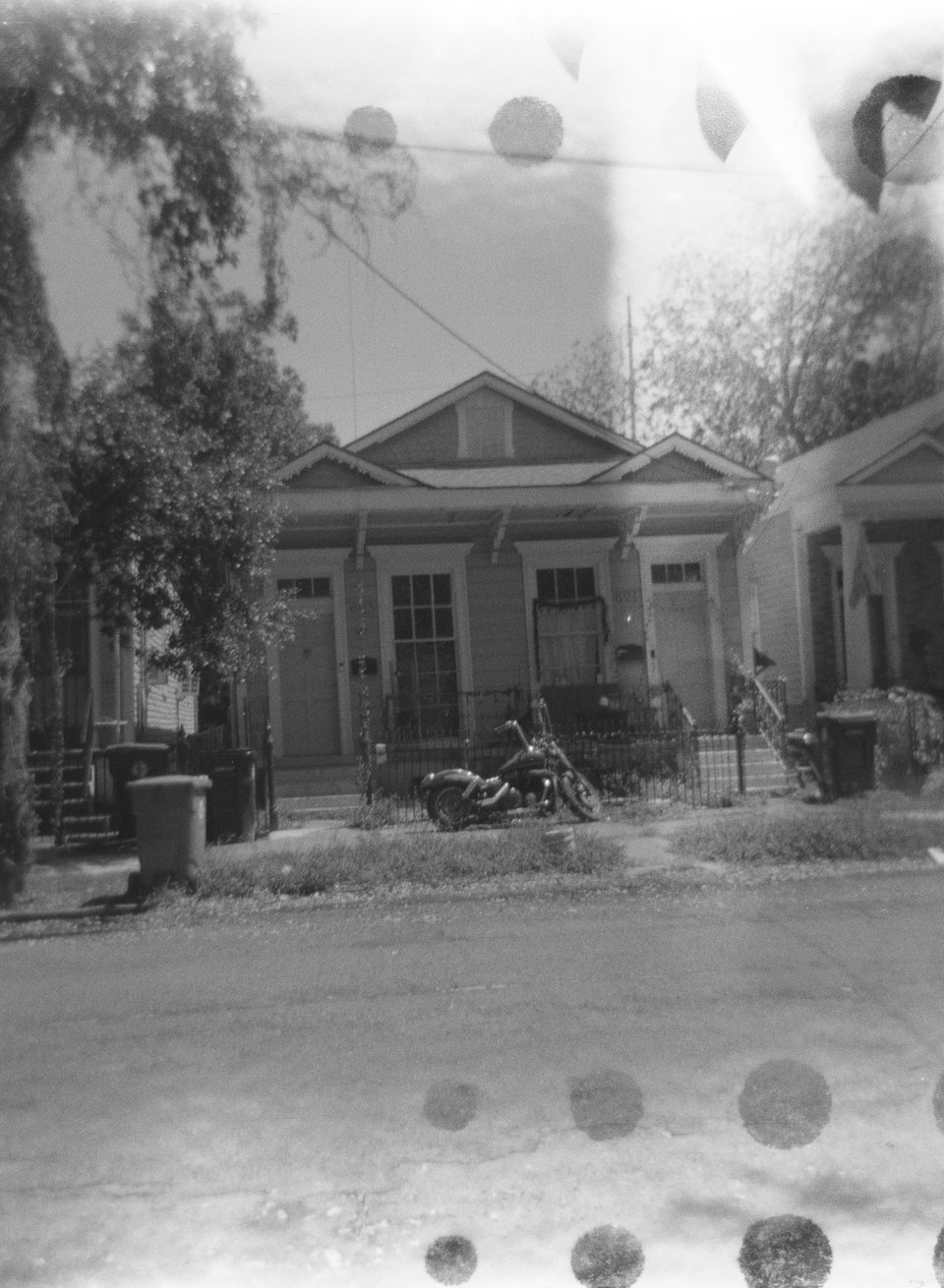 a house with a motorcycle parked in front of it